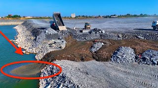 Next Activity Amazing the project of pouring rocks into a deep lake with transport by trucks &Dozer