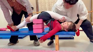 Dancing girl endures pain to practice flexibility