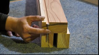 How a Japanese woodworker hides cold metal in the legs of a giant table