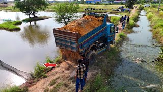 Smooth Opening for New Landfill Project Processing By Truck & Dozer Pushing Soil into water, Mix VDO